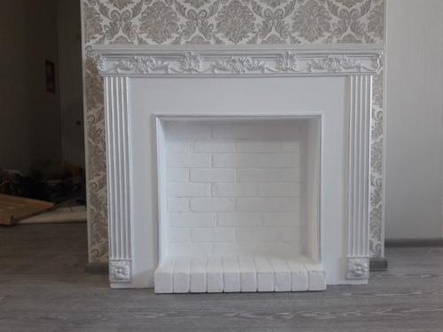 Отделка камина гипсом. Особенности и характеристика материала